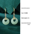Women's sterling silver jewellery set with gourd bracelet, Fu necklace, and earrings featuring inlaid Hetian jade.