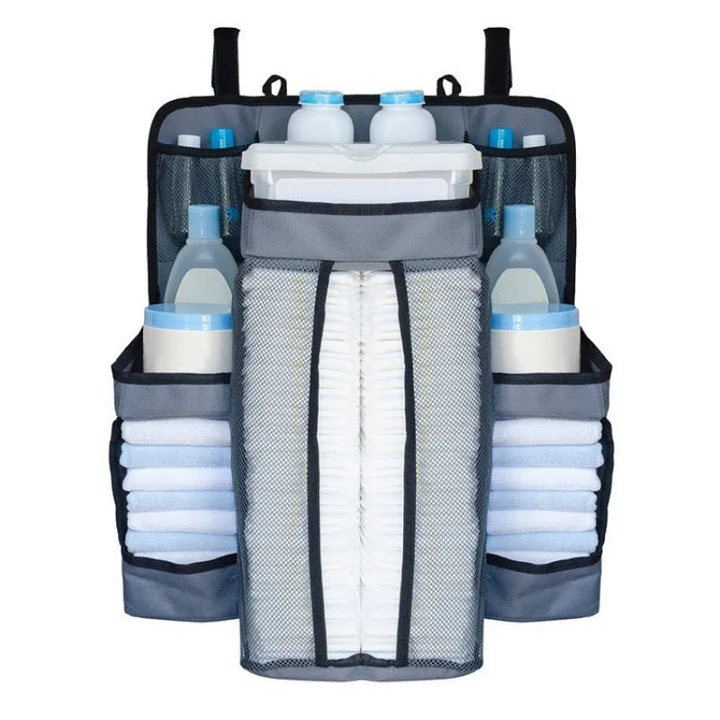 Gray baby diaper organizer hanging on crib with adjustable Velcro straps, TC Oxford cloth construction
