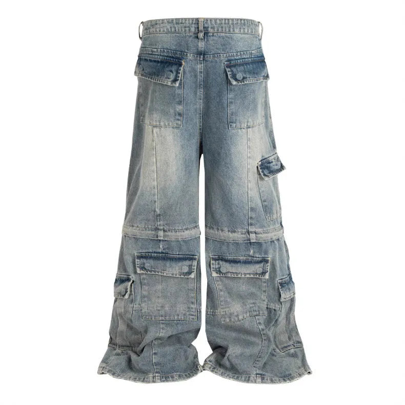 Black washed-out cotton overalls with detachable straps and multiple pockets on a hanger.