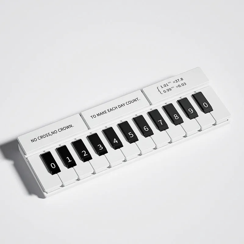 Black and white plastic piano temporary parking sign for car dashboard.
