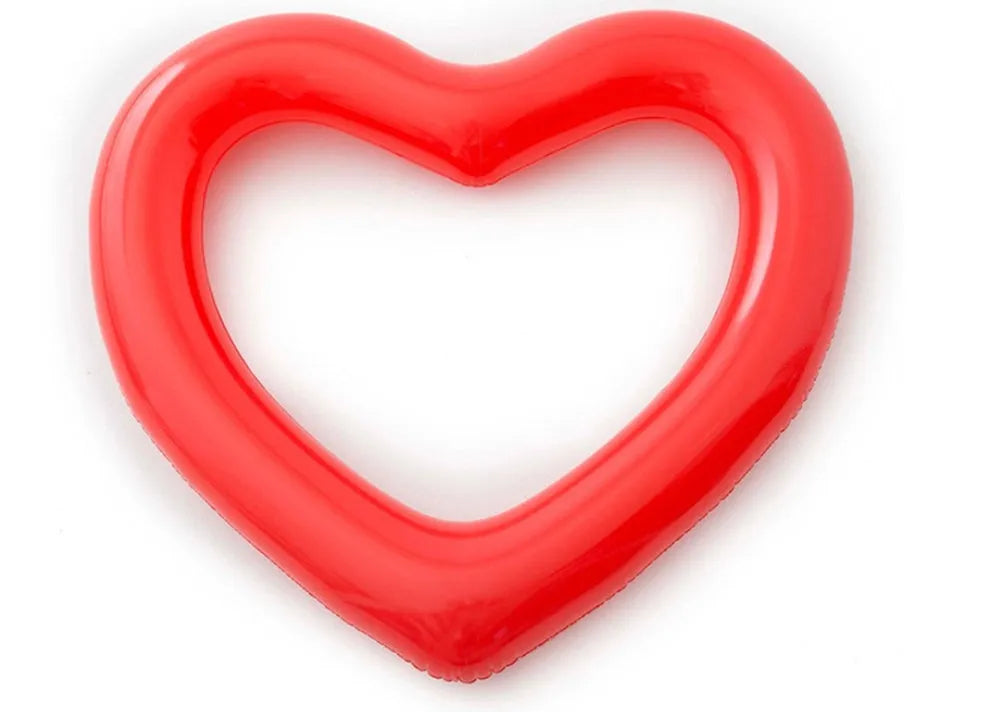 Oversized 120cm heart shaped swim ring in pink floating on water, adult outdoor pool toy