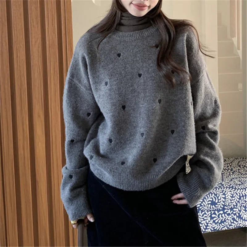 Women's loose acrylic pullover sweater with embroidery details in milky white colour