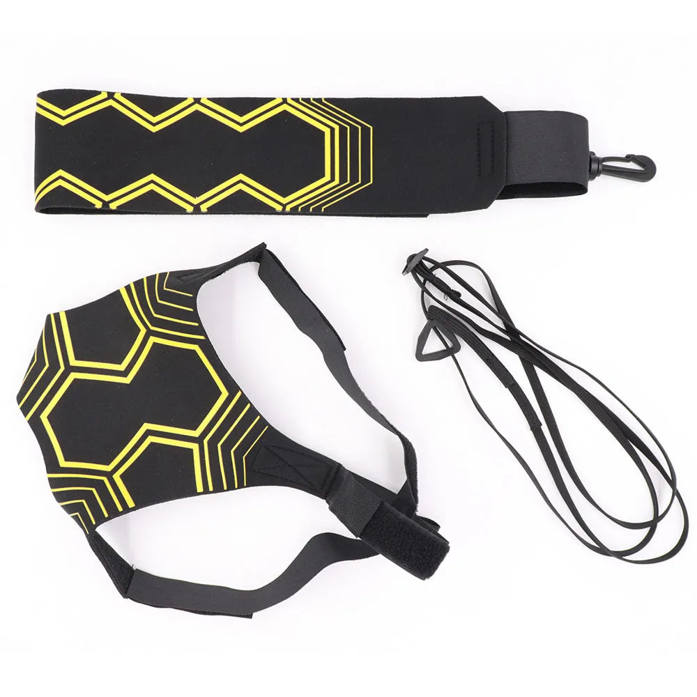 Black soccer training tether with adjustable waist belt and elastic Velcro strap on a green grass field