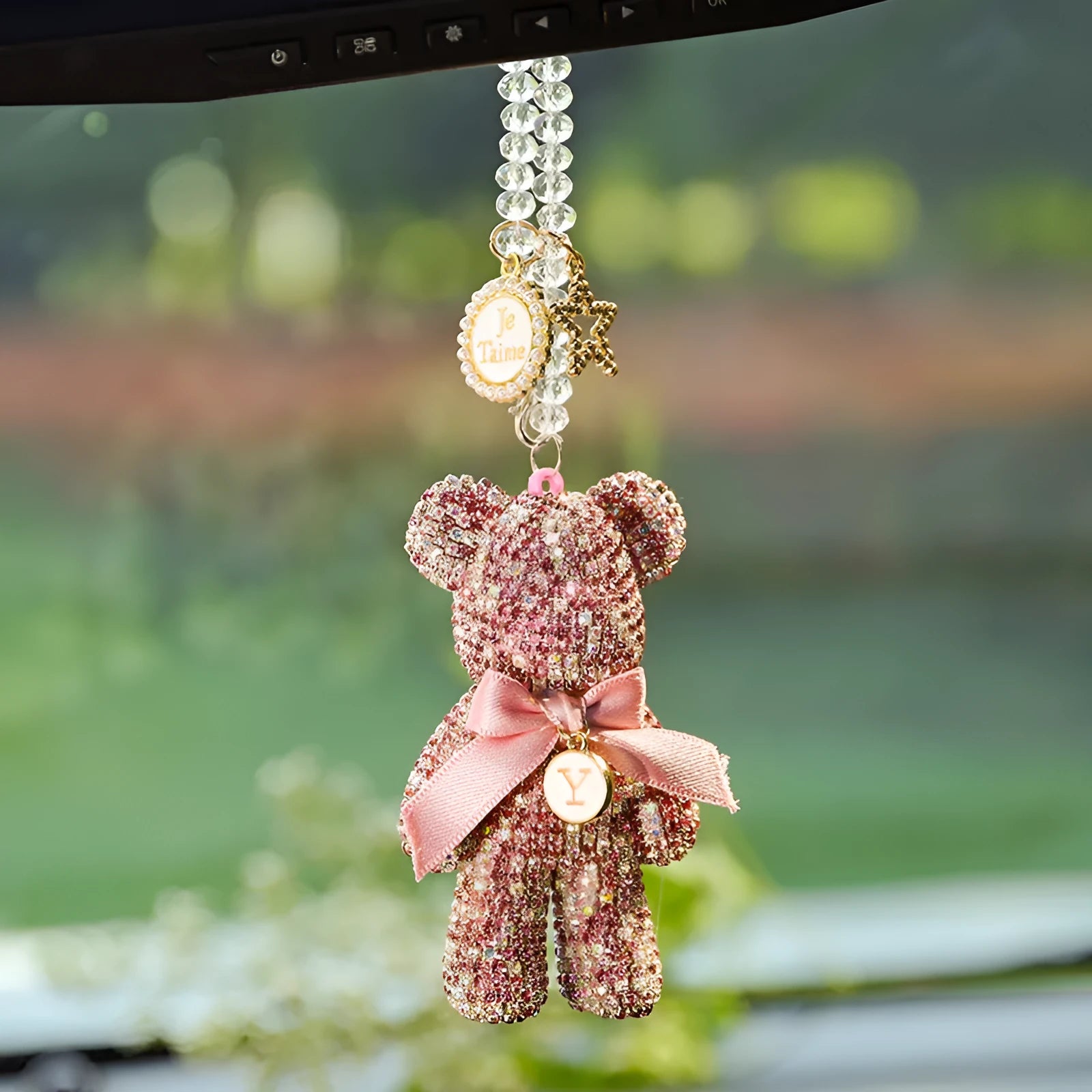 Crystal rhinestone Violent Bear car rearview mirror pendant in black, white, and mixed pastel colours.