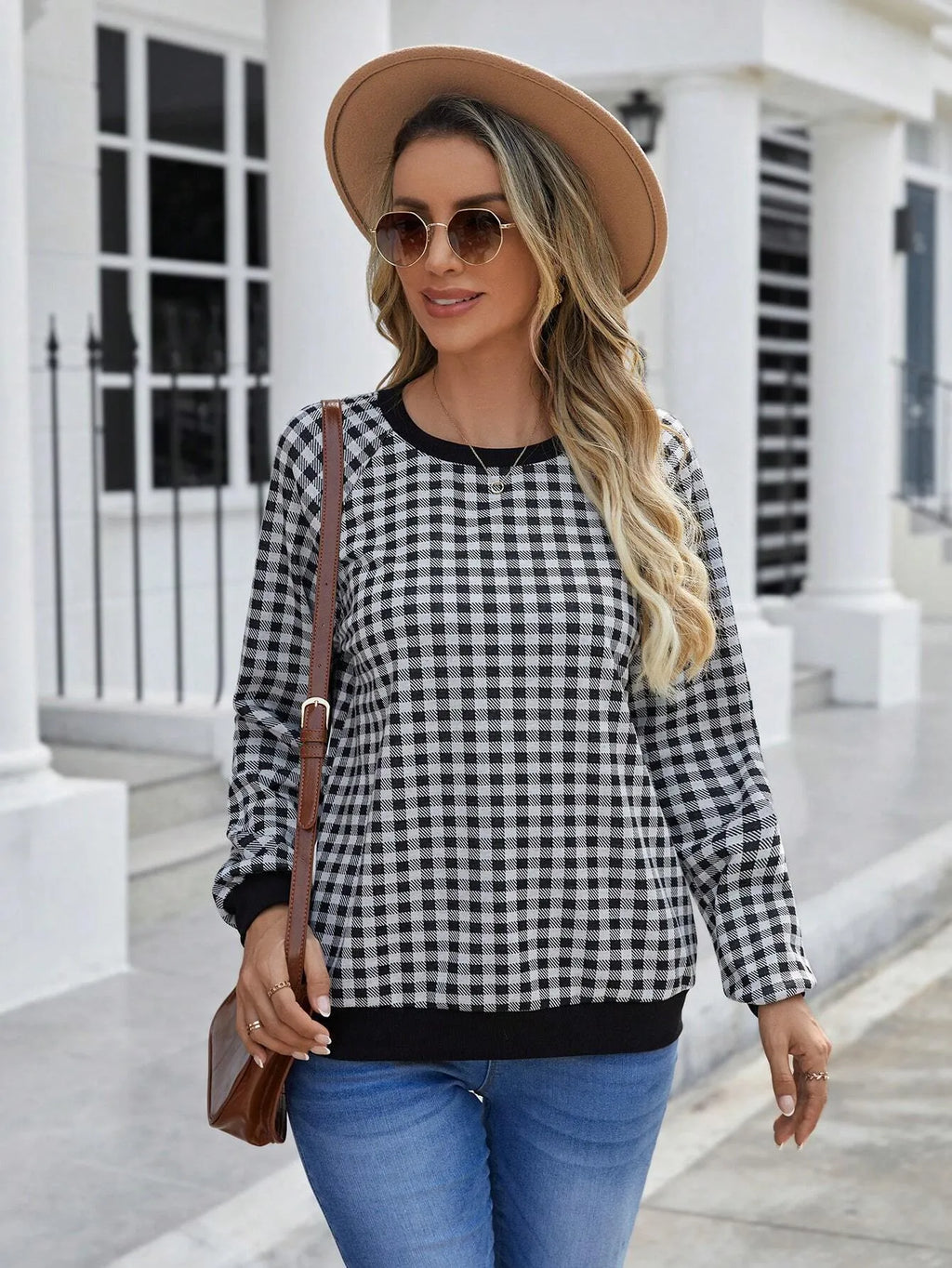 Black long sleeve pullover sweater with plaid and striped printed pattern
