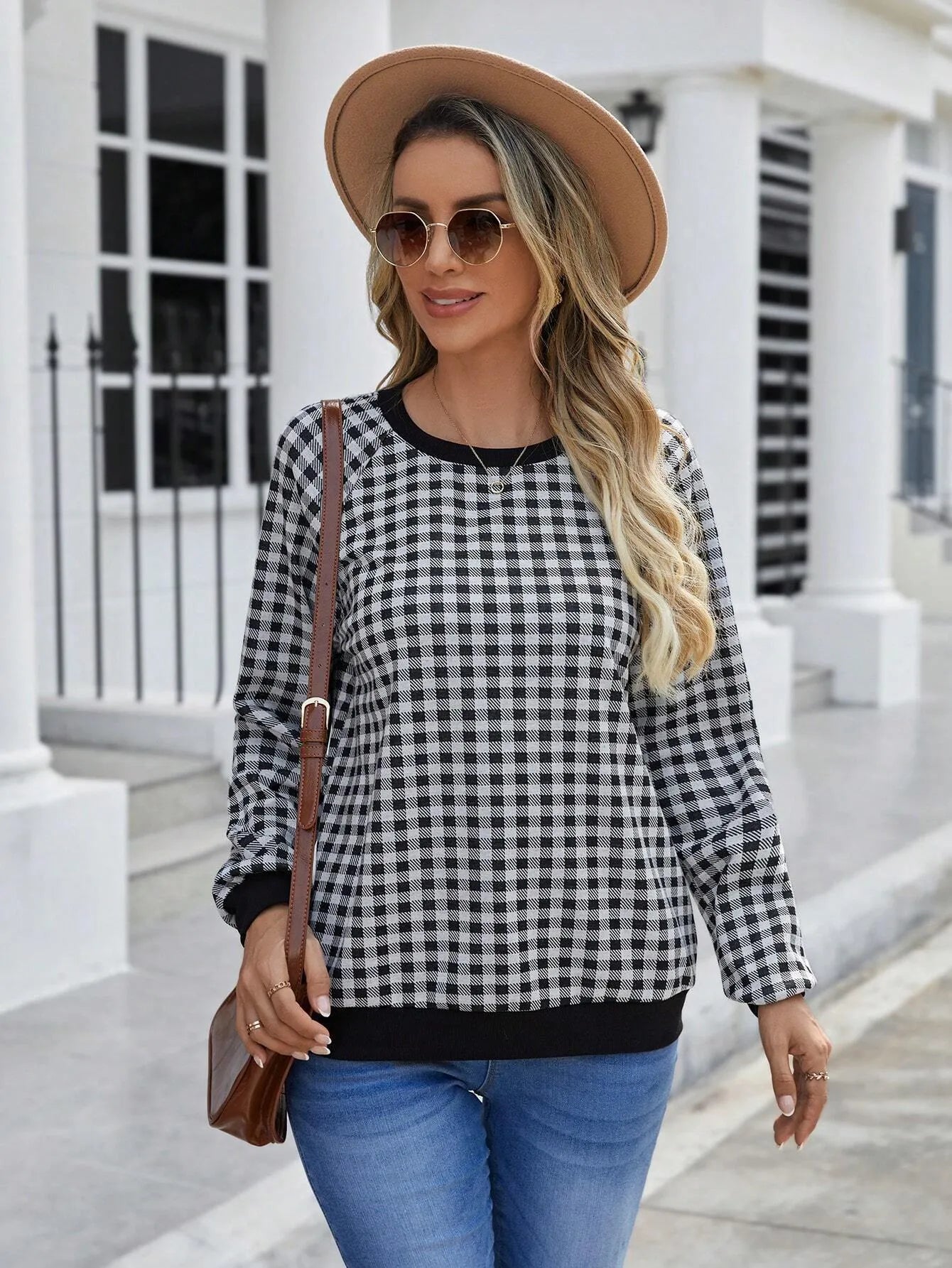 Black long sleeve pullover sweater with plaid and striped printed pattern