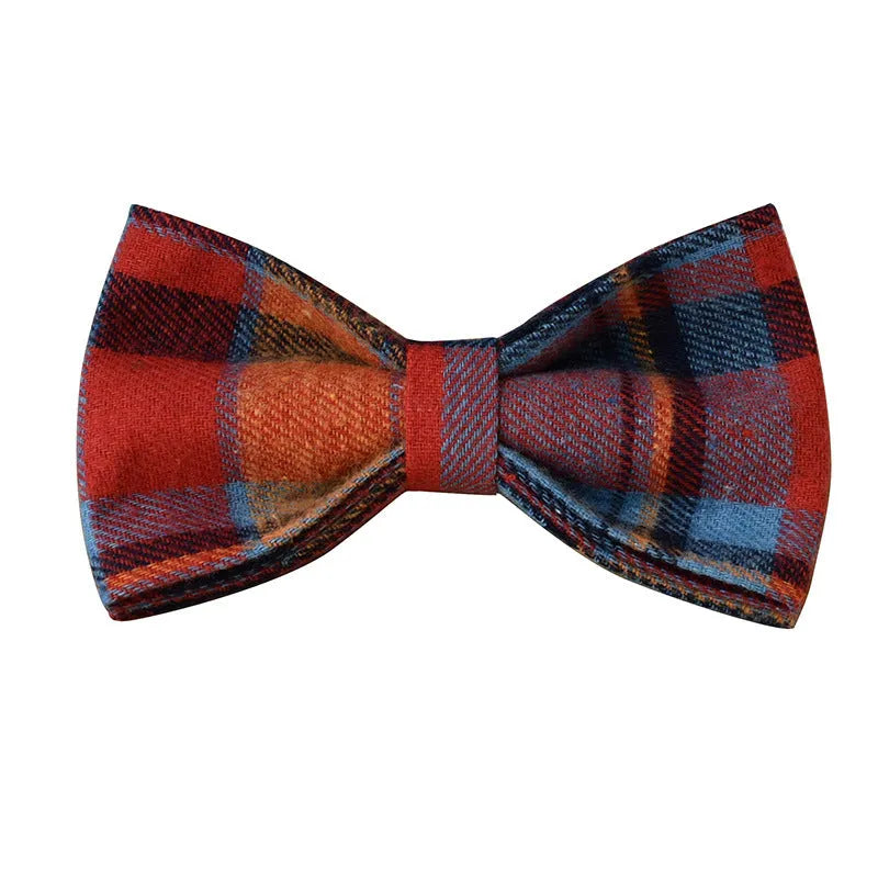 Blue background velvet plaid dog collar with a silver alloy buckle on a size tag.