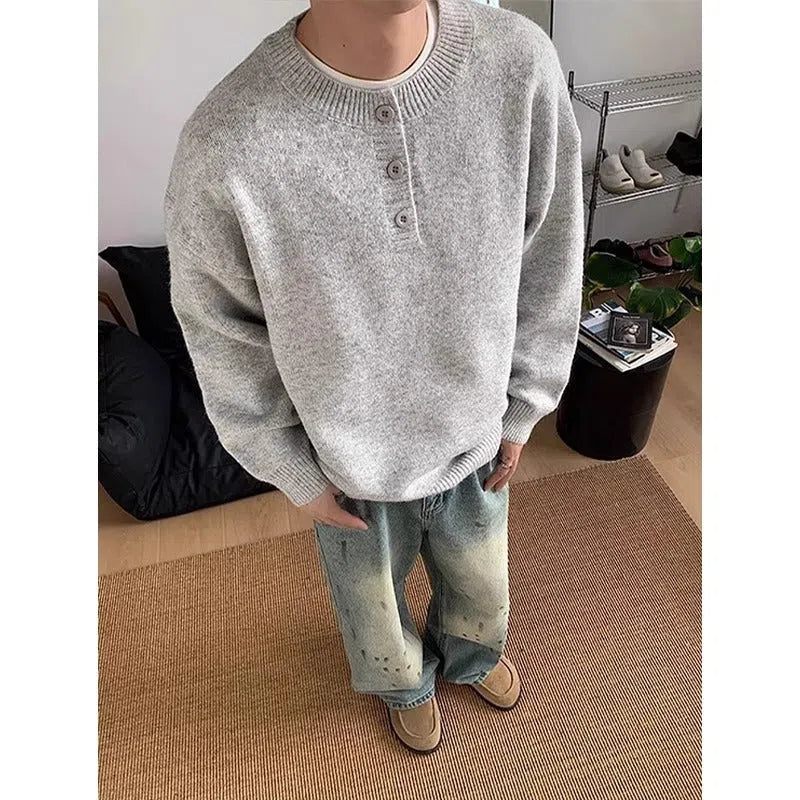 Men's loose long sleeve knit sweater in black, front view, casual pullover style