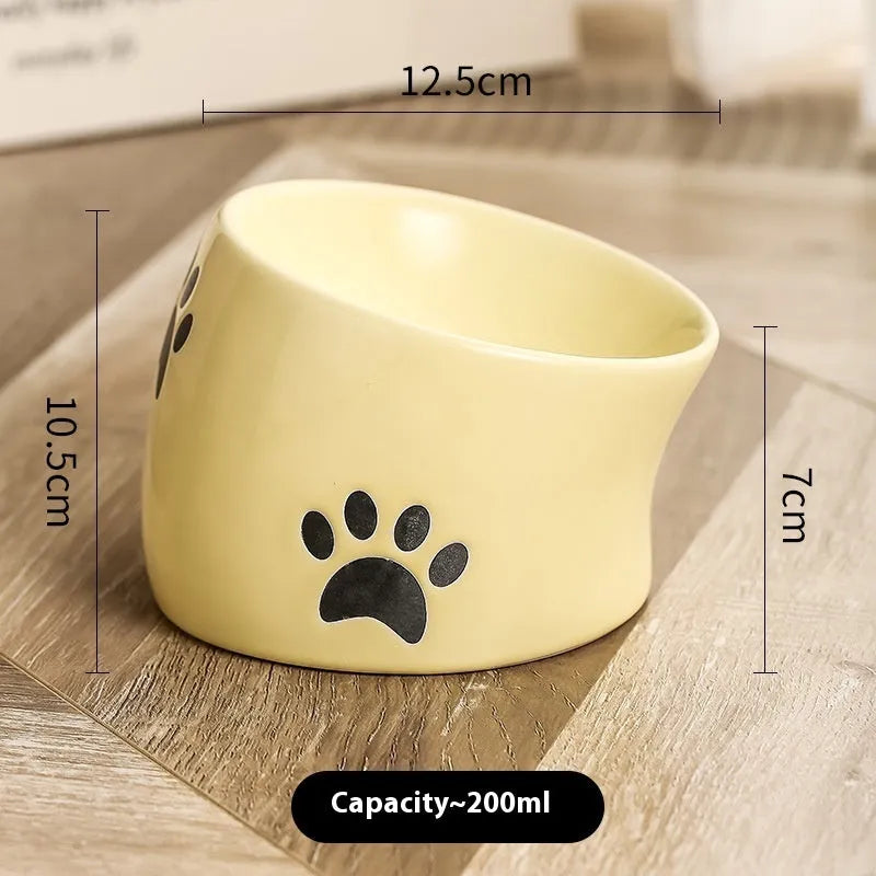 Ceramic cat bowl with high foot design in cat's paw pattern available in multiple colours