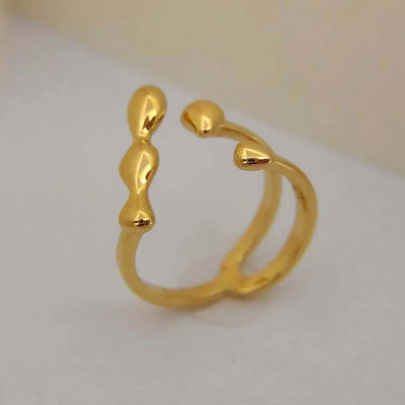 Brass women's fashion ring with spherical design in gold or silver colour