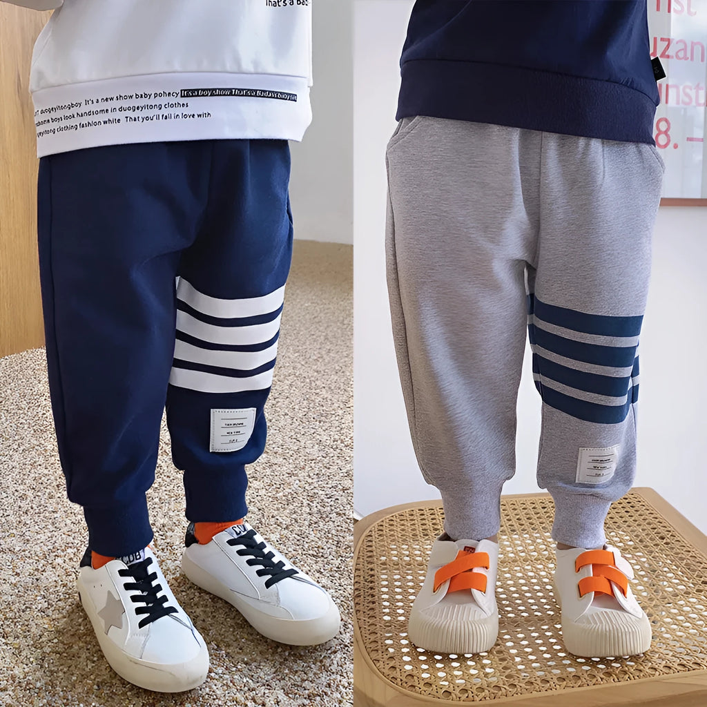 Boys' grey cotton sports trousers with elasticated waistband on child model