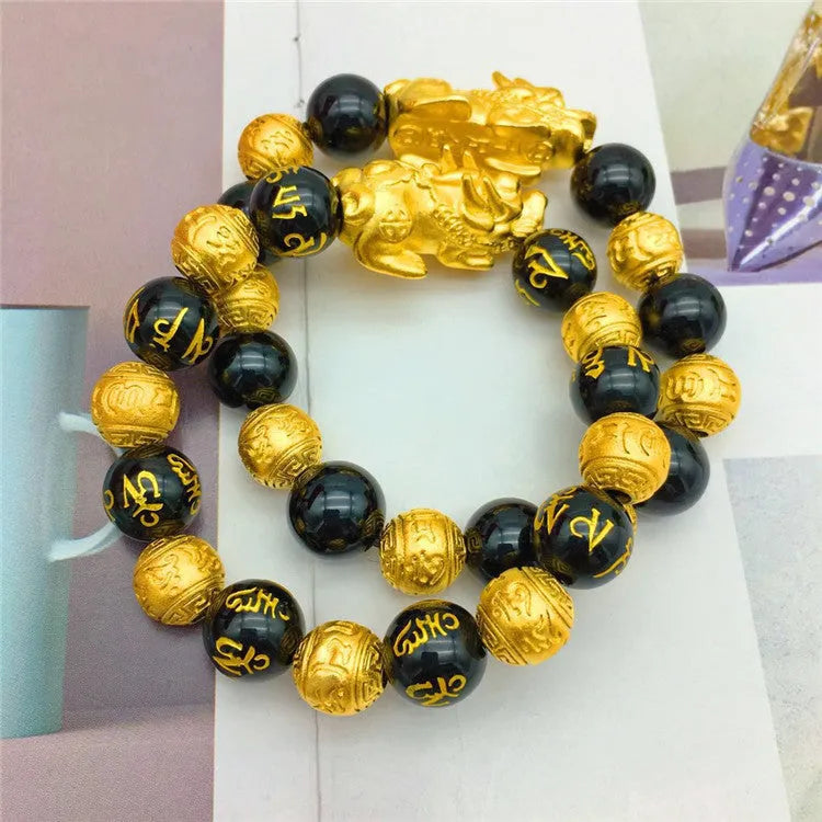 Vietnamese sand gold gold-plated brave bracelet with black beads on display