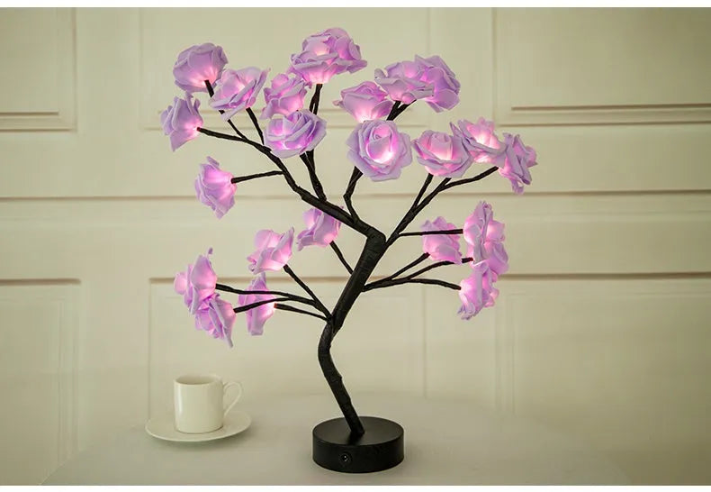 White and red rose flower LED table lamp with bonsai tree lights on a table.