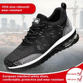 Men's black low-top steel toe cap safety work shoes with a woven mesh upper on a grey background.