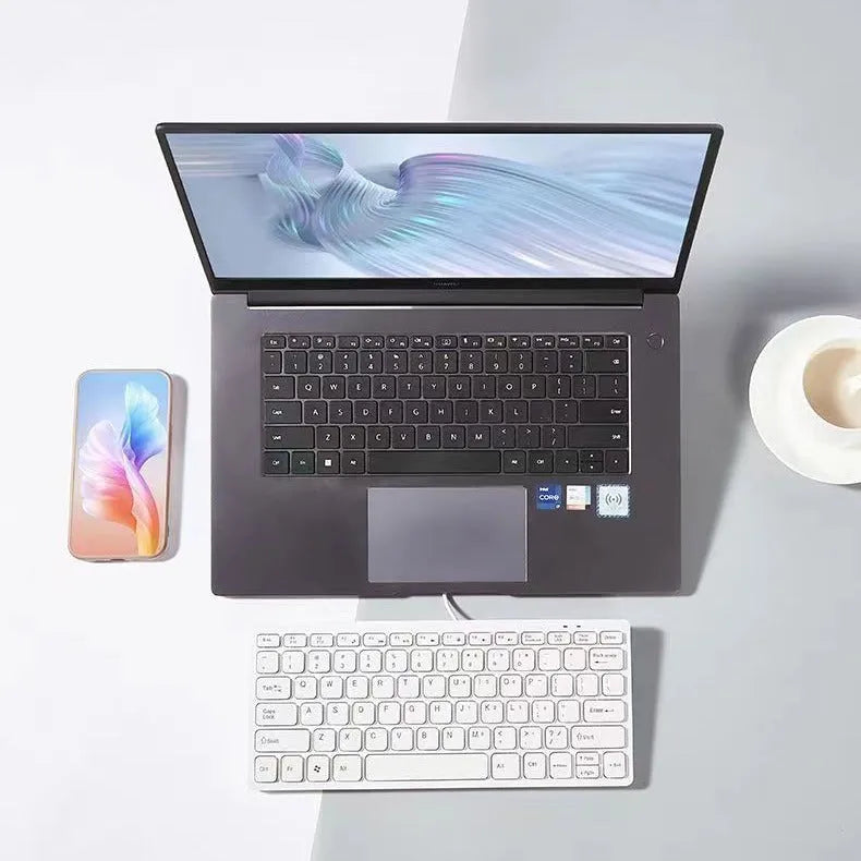 Mini USB wired keyboard for laptops in black, white, pink, or blue colours with 1.3 metre cable