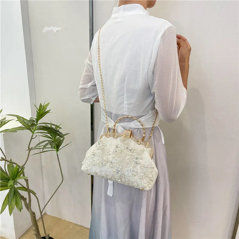 Pearl embroidered soft polyester handbag with double shoulder straps in floating light-white colour