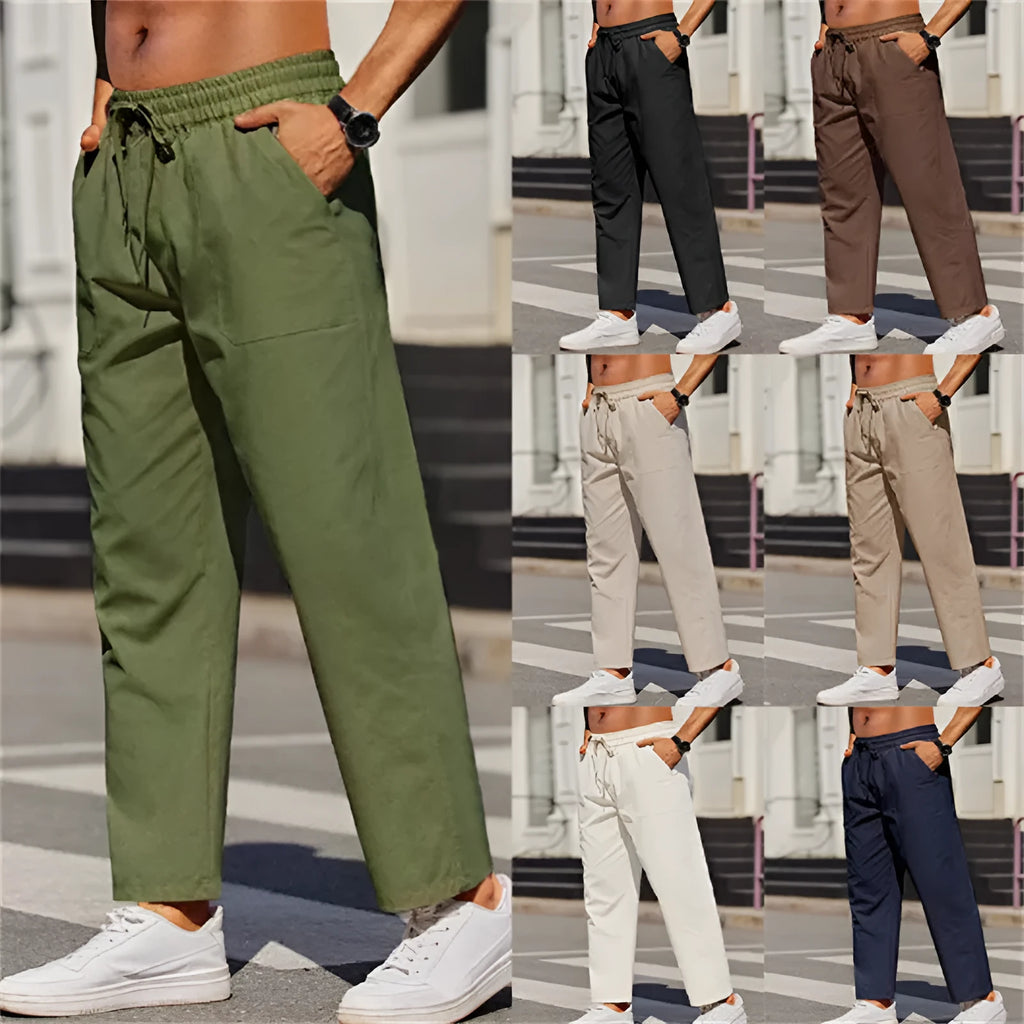 Men's straight-leg linen trousers in a solid colour, showing the elasticated mid waist and long leg.