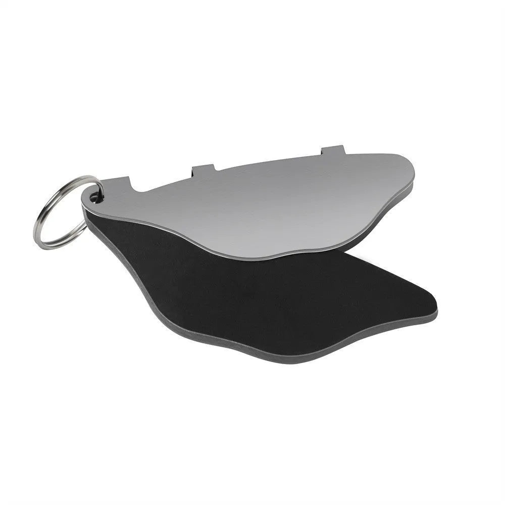 Black and orange mountain bike disc brake pads with a scratch-proof design.