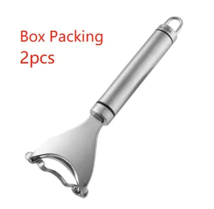 Stainless steel corn planer kitchen tool on a wooden surface