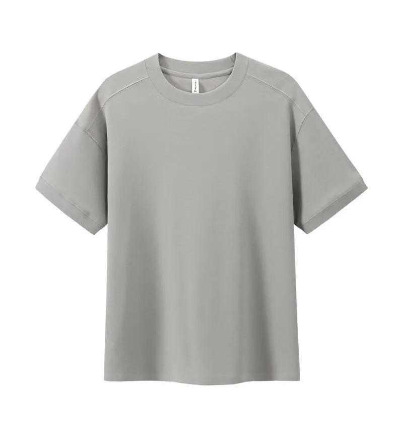 Men's loose grey cotton short-sleeved t-shirt on a hanger, casual summer wear.