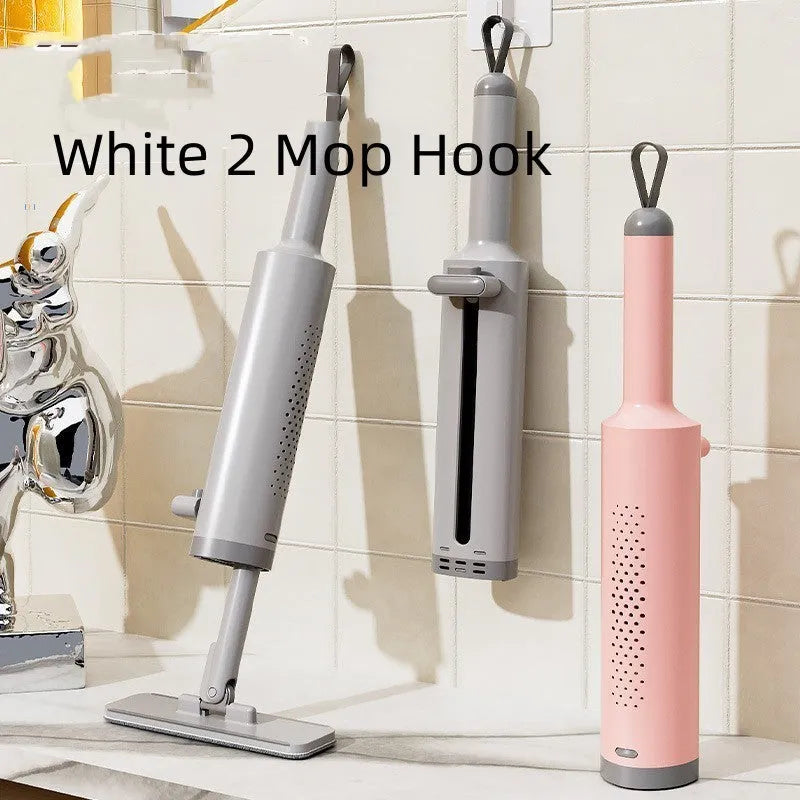 Rotatable self-squeeze mini flat mop with crevice brush and pink microfiber pad, shown extended to 19.3 inches.