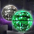 Luminous PU soft leather basketball in blue glow colour on outdoor court