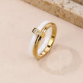 Women's titanium steel heart-shaped double ring with glossy stitching and zirconium accents in gold black.