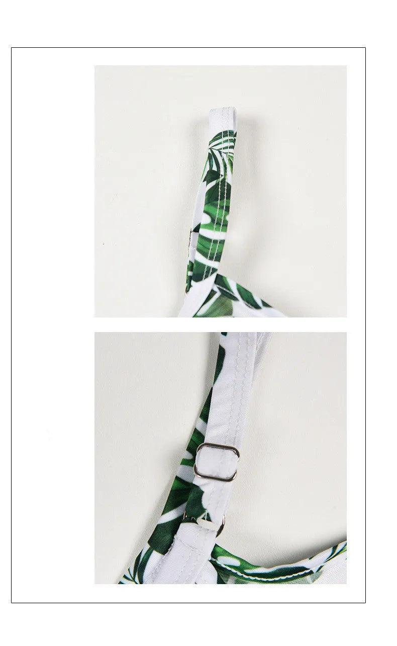 Women's green leaf style printed one-piece swimsuit laid flat.