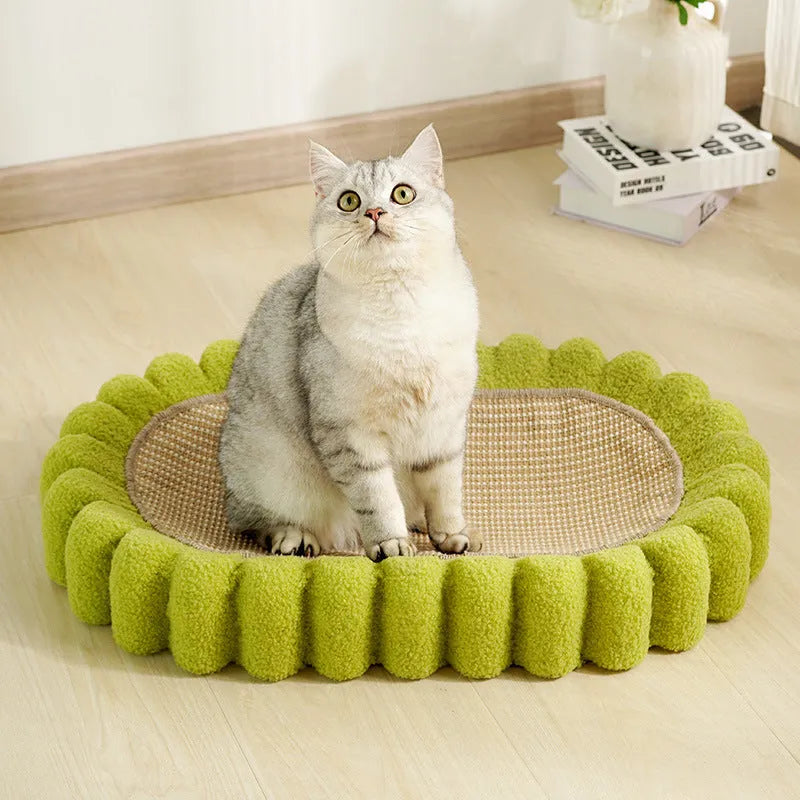 Green oval cat scratcher bed made of sisal, showing scratching surface and lounging area.