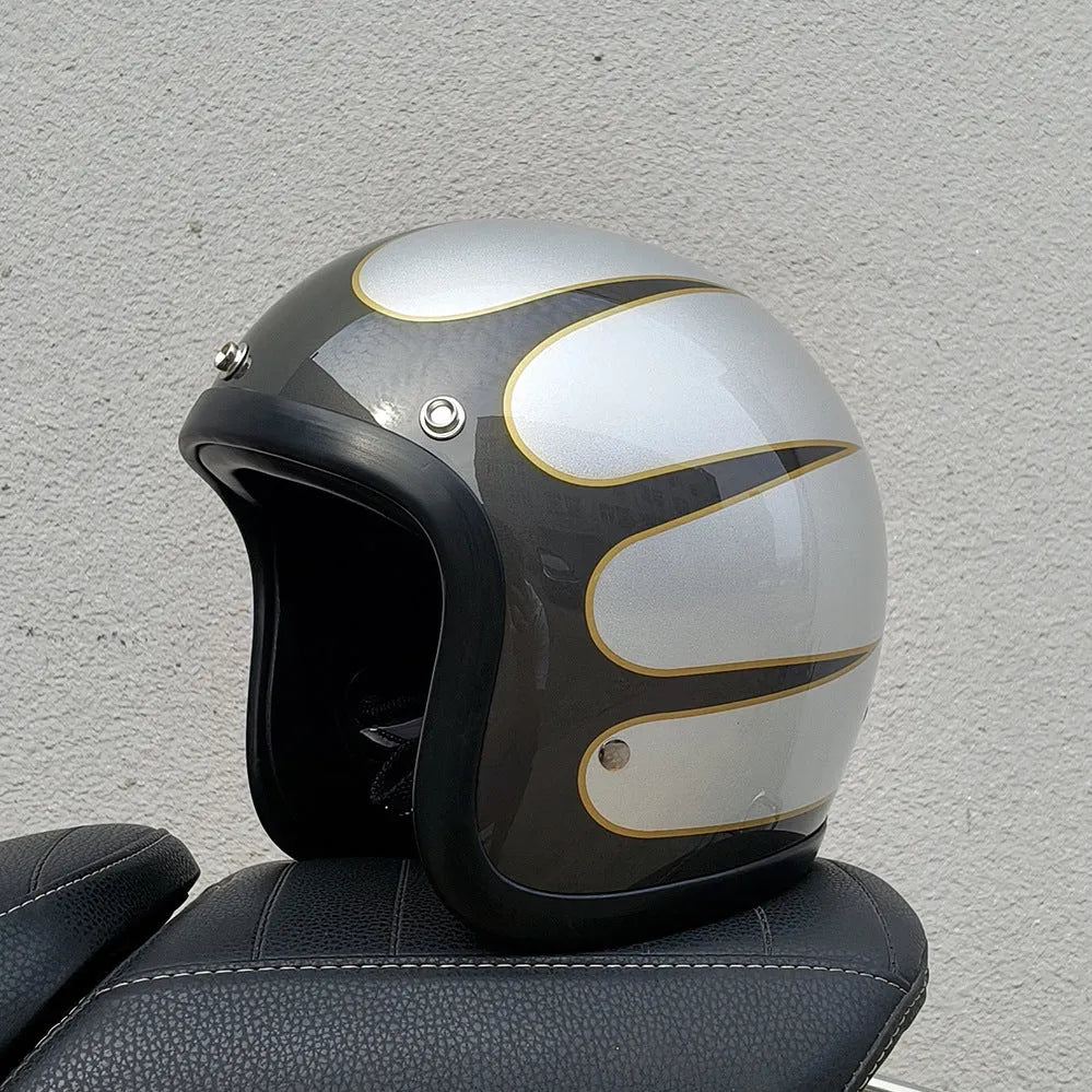 A retro-style grey half helmet for motorcycle riding, shown on a stand.