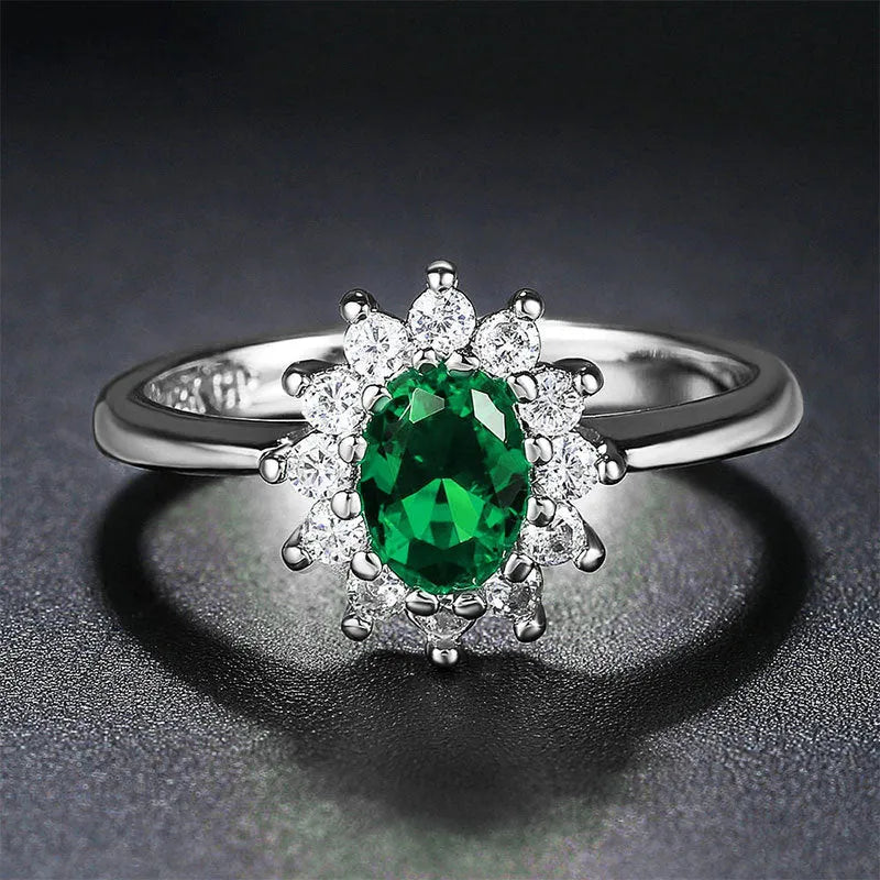 Blue moissanite stone set in a copper flower-shaped ring available in green, red, or blue.