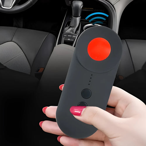 Black portable camera and GPS signal detector with USB charging port on a flat surface.