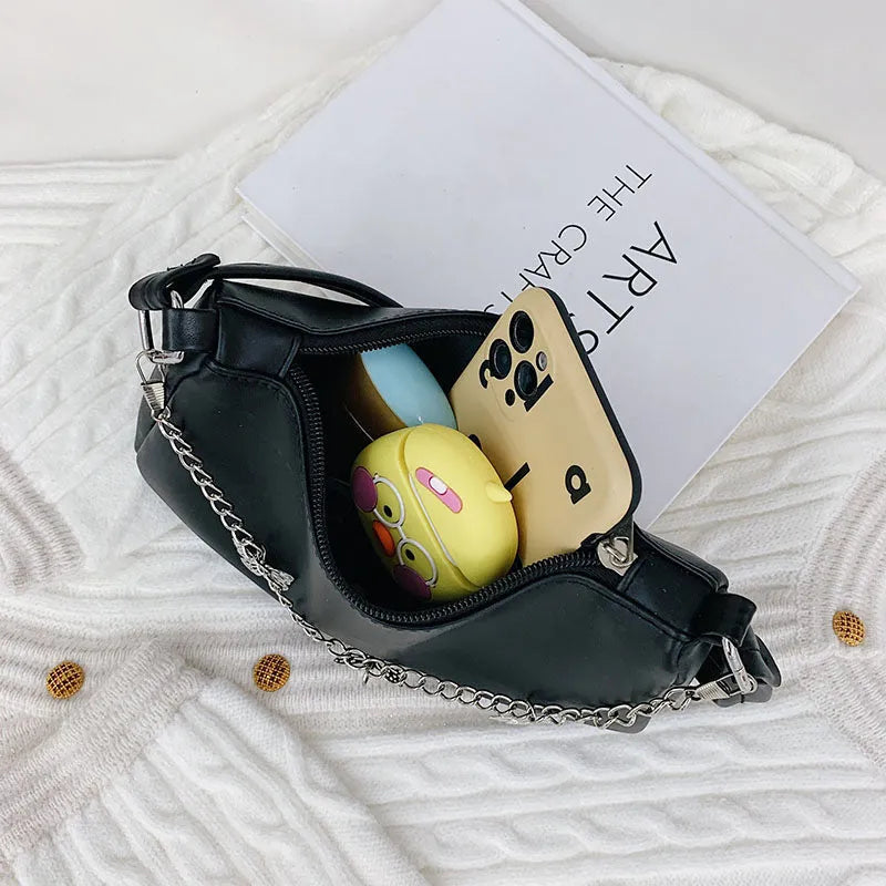Women's black retro-style crossbody bag with chain strap and structured square shape.