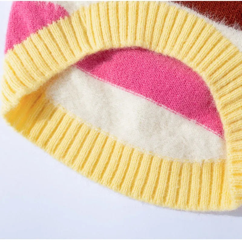 Corgi special rainbow apple striped knitted dog pullover sweater in brown and white on a light background