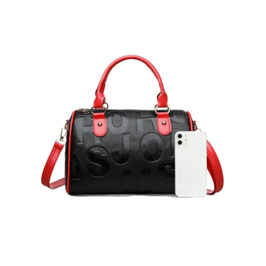 Brown cylindrical PU crossbody bag with a leather-like texture and three shoulder straps.