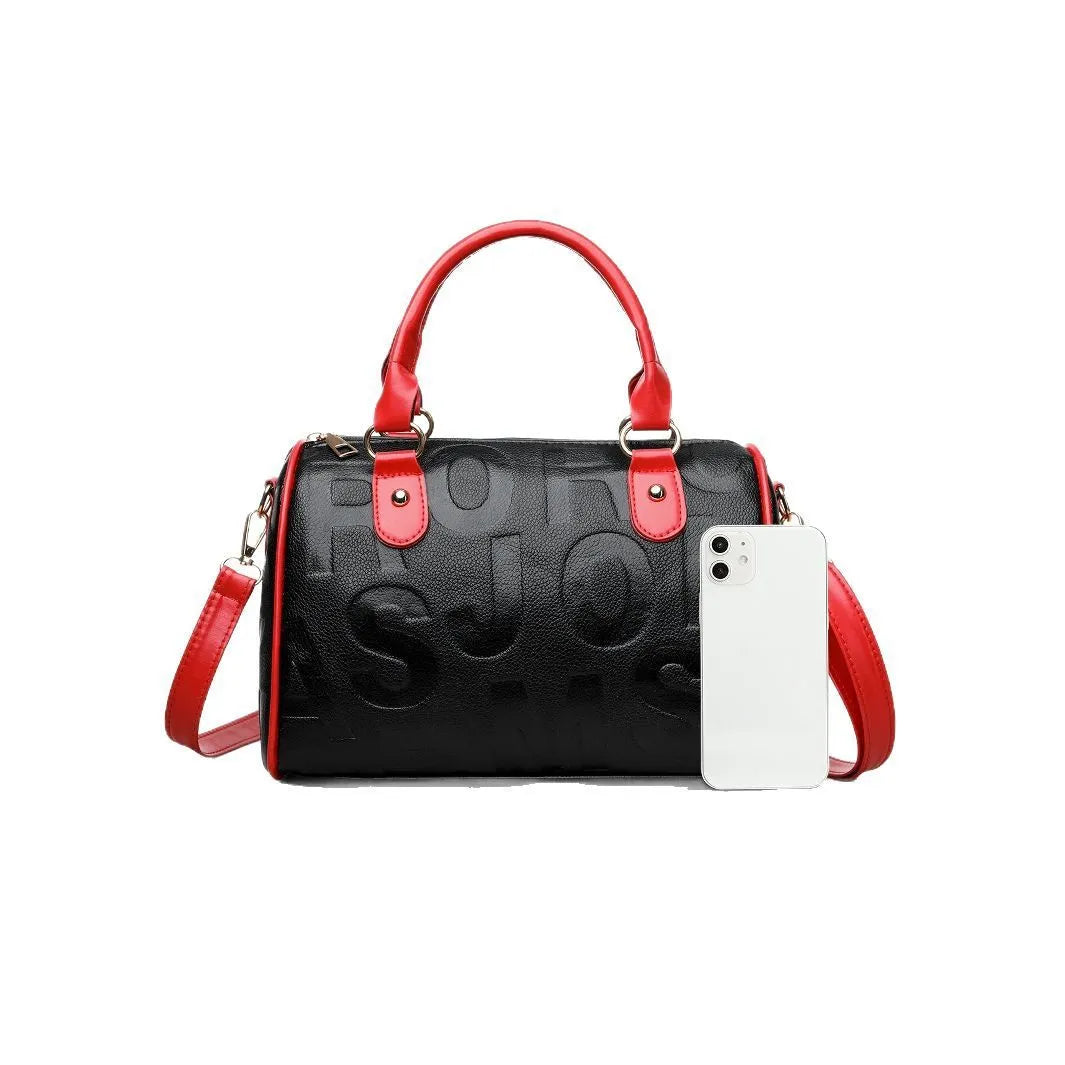 Brown cylindrical PU crossbody bag with a leather-like texture and three shoulder straps.