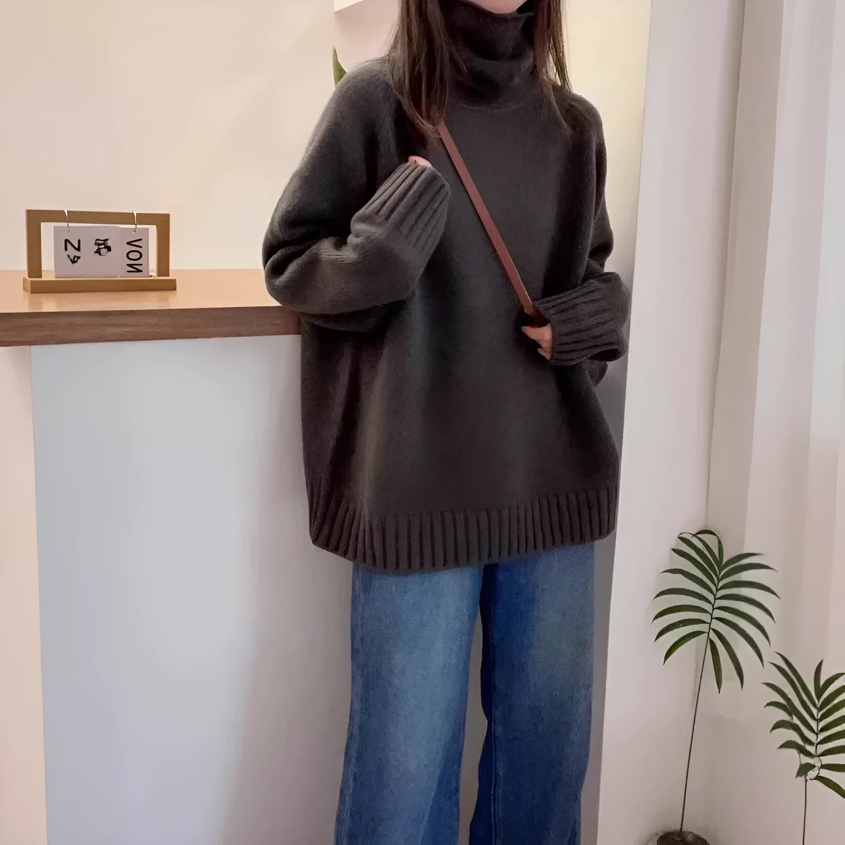Women's loose fit turtleneck sweater with curling pile collar in thick polyester fabric