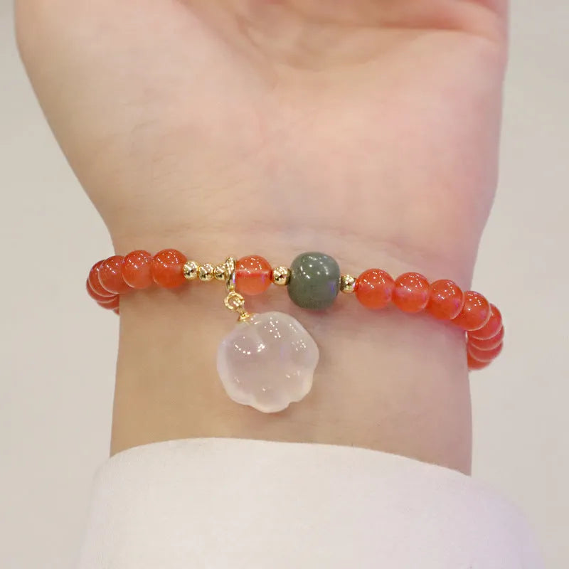 Natural red agate bracelet with jade inlay and a cat paw charm on a 6mm band.