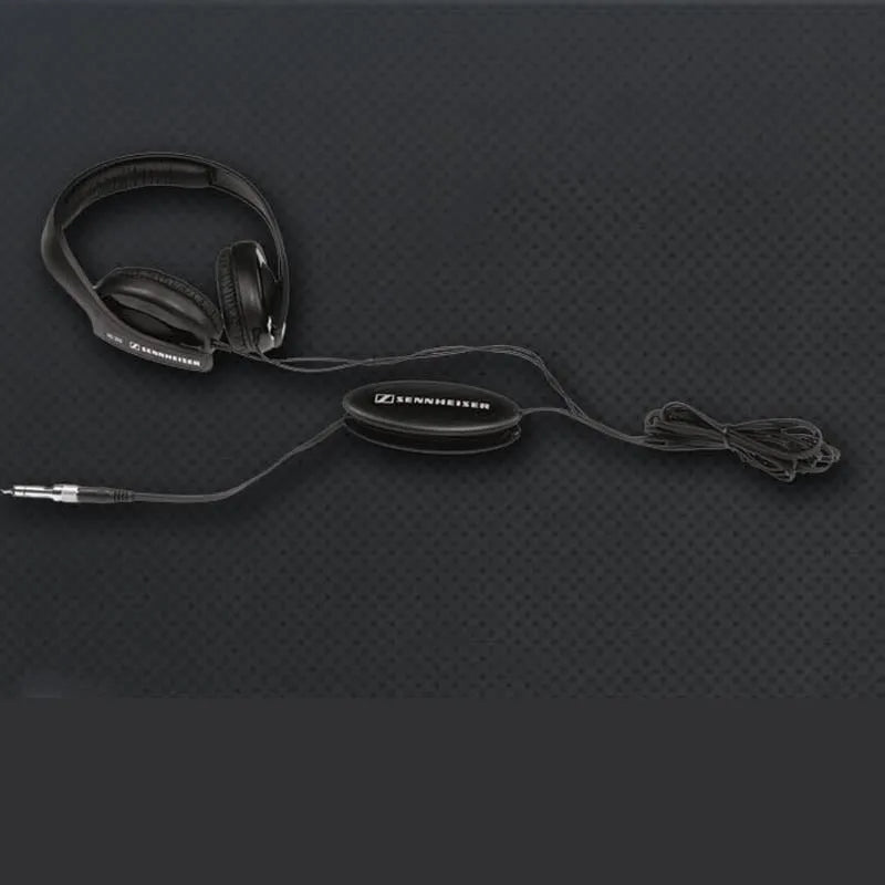 Black wired head-mounted monitor headphones with 40mm driver and 2.5m cable on a desk