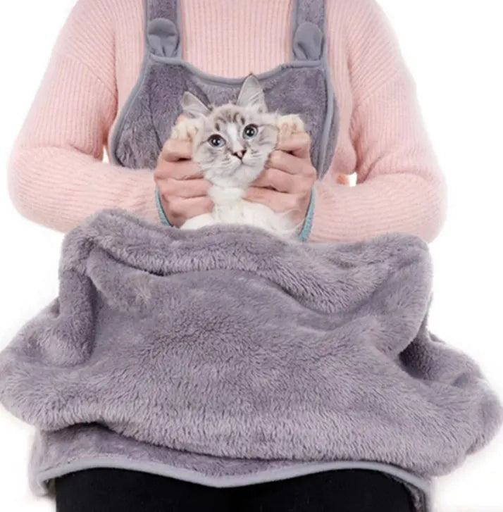 Grey pet out cat carrying bag with sleeping chest apron on a neutral background