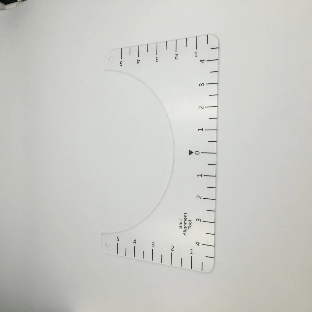 Transparent acrylic sewing patch ruler measuring 10x6 inches for T-shirt alignment and garment construction