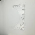 Transparent acrylic sewing patch ruler measuring 10x6 inches for T-shirt alignment and garment construction