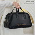 PU leather travel toiletry bag in classic black colour, showing large capacity and zipped compartments.