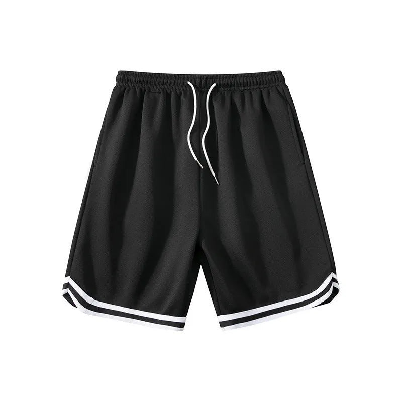 Man wearing loose-fit black polyester sports shorts for summer leisure activities.