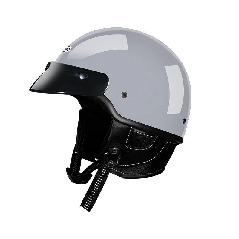 Retro style motorcycle helmet on a solid background, shown in a choice of ivory white, black, or grey.