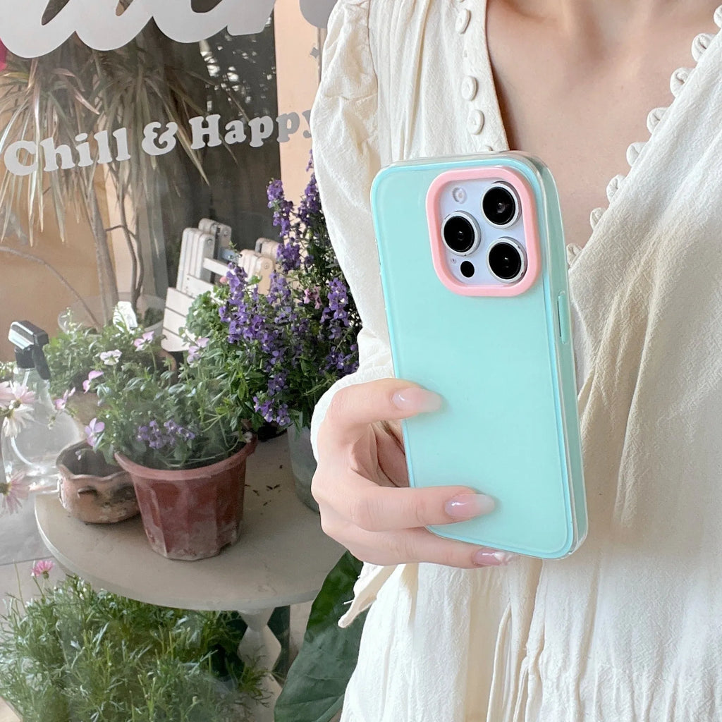 Simple solid colour jelly TPU phone case for iPhone, shown in blue, white, and yellow.