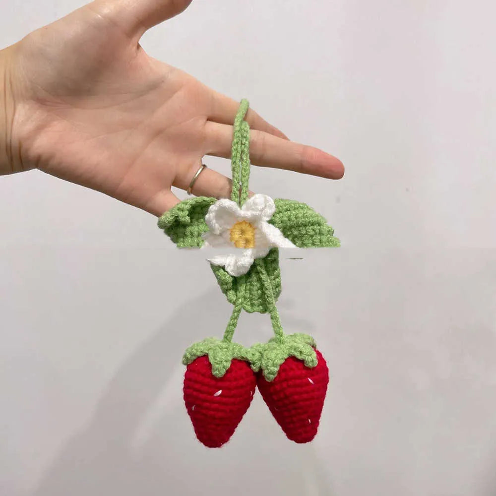 Handmade strawberry-shaped weaving pendant made from cotton and hemp fibres for decorative hanging