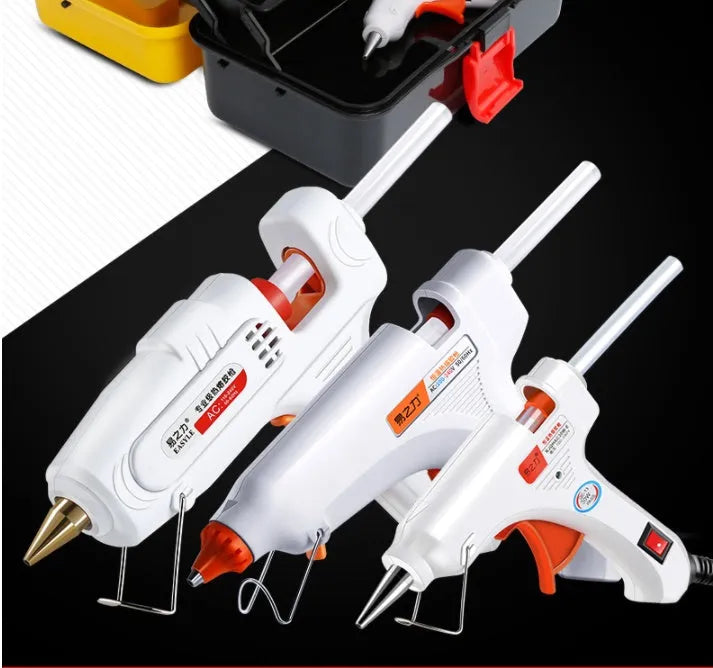 White electric hot melt glue gun with safety switch LED, anti-heat blanket, and metal stand.