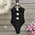 Solid colour one-piece swimsuit with matching short skirt, hollow-out tube top, black variant