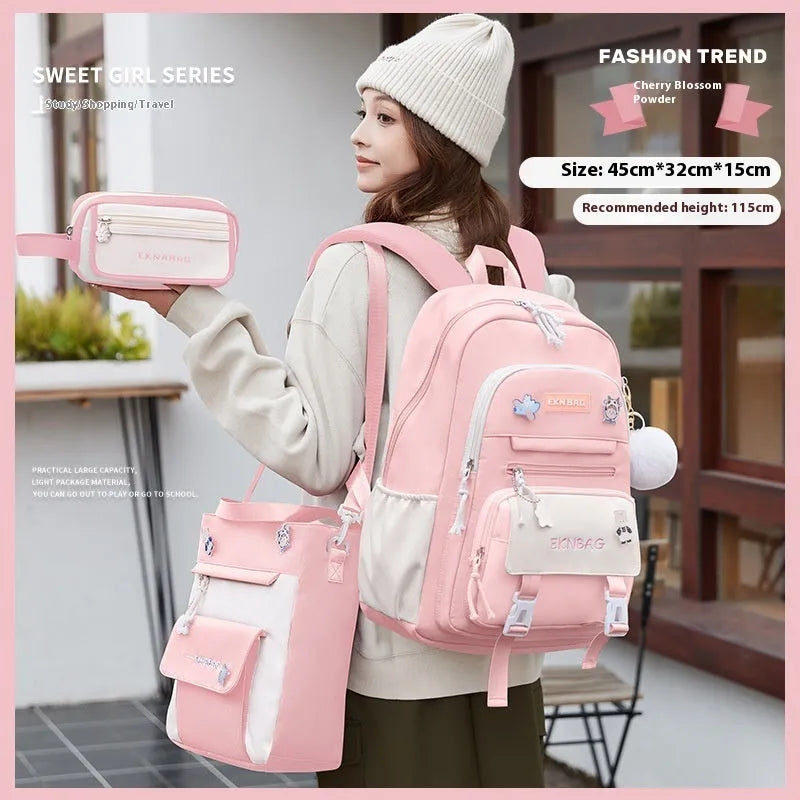 Girls' pink waterproof Oxford cloth school backpack with curved shoulder straps.